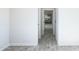 Hallway with wood-look floors offering a view into the kitchen at 24825 W Western Star Blvd, Buckeye, AZ 85326