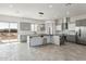 Spacious kitchen featuring modern appliances and a large island at 24825 W Western Star Blvd, Buckeye, AZ 85326
