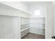 Bright and spacious pantry with ample shelving at 24825 W Western Star Blvd, Buckeye, AZ 85326
