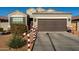 Festive front yard of a single-story home decorated for the holidays at 268 S San Jose Ln, Casa Grande, AZ 85194