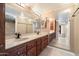 Bathroom with double vanity, large mirror, and tile flooring at 4303 E Cactus Rd # 146B, Phoenix, AZ 85032