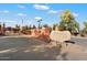 Entrance to Anasazi Village with security gate and desert landscaping at 4303 E Cactus Rd # 146B, Phoenix, AZ 85032
