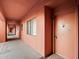 Exterior hallway leading to the front door of the unit at 4303 E Cactus Rd # 146B, Phoenix, AZ 85032