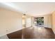 Living area with sliding glass doors, wood-look flooring, and neutral walls at 4303 E Cactus Rd # 146B, Phoenix, AZ 85032