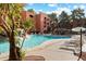 Resort-style pool area with lounge chairs and a natural rock waterfall at 4303 E Cactus Rd # 146B, Phoenix, AZ 85032