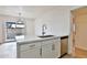 Modern kitchen featuring white shaker cabinets, marble countertops, and stainless steel appliances at 459 E Hampton Ave, Mesa, AZ 85204