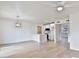 Open living area with wood-look flooring and adjacent kitchen at 459 E Hampton Ave, Mesa, AZ 85204