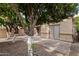 Landscaped backyard featuring mature citrus trees and a patio at 4831 W Del Rio St, Chandler, AZ 85226