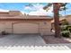 Beige stucco exterior with tile roof and attached two-car garage at 4831 W Del Rio St, Chandler, AZ 85226