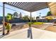 Modern pergola with grassy lawn and fire pit area at 607 E Manhatton Dr, Tempe, AZ 85282