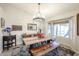 Dining area with a large window and wooden table with matching bench seating at 6180 N 88Th Ln, Glendale, AZ 85305