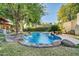 Stunning kidney-shaped pool with a waterfall feature at 6315 N 16Th Ave, Phoenix, AZ 85015