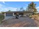 Single-story home with desert landscaping and a two-car garage at 6439 E Presidio Rd, Scottsdale, AZ 85254