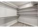 Spacious walk-in closet with built-in shelving and ample hanging space at 9049 E Vine Ave, Mesa, AZ 85208