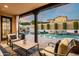 Tranquil backyard oasis with a pool, spa, and lush landscaping at 9424 E Hidden Spur Trl, Scottsdale, AZ 85255