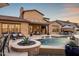 Inviting backyard with a pool, spa, and desert landscaping at 9424 E Hidden Spur Trl, Scottsdale, AZ 85255