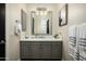 Elegant bathroom featuring a single vanity, modern fixtures, and ample counter space at 9424 E Hidden Spur Trl, Scottsdale, AZ 85255