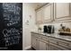 Charming coffee bar area with ample counter space, cabinetry, and a fun chalkboard design at 9424 E Hidden Spur Trl, Scottsdale, AZ 85255