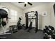 Well-equipped home gym with various exercise machines and weights at 9424 E Hidden Spur Trl, Scottsdale, AZ 85255