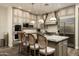 Spacious kitchen with granite countertops, ample cabinetry, stainless steel appliances, and an island at 9424 E Hidden Spur Trl, Scottsdale, AZ 85255