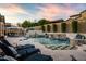 Relaxing pool area with water features, lush greenery, and string lights at 9424 E Hidden Spur Trl, Scottsdale, AZ 85255