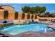 Beautiful pool with cascading waterfalls and lush landscaping at 9424 E Hidden Spur Trl, Scottsdale, AZ 85255