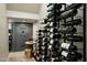Custom wine cellar with extensive storage, a safe, and stylish decor at 9424 E Hidden Spur Trl, Scottsdale, AZ 85255