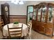 Dining area features a round table, chairs, and a large hutch at 11012 W Thunderbird W Blvd, Sun City, AZ 85351