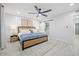 Main bedroom with wood bed frame and barn door to closet at 11615 N 30Th St, Phoenix, AZ 85028