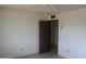 Bedroom with ceiling fan and door to hallway at 12218 N Mission Dr, Sun City, AZ 85351