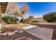 Landscaped backyard with gravel and concrete patio at 131 N Del Pueblo Pl, Chandler, AZ 85226