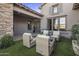 Relaxing patio with wicker furniture and artificial turf at 13207 E Parkview Ln, Scottsdale, AZ 85255