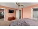 Comfortable bedroom with large TV and walk-in closet at 1414 N 80Th Ln, Phoenix, AZ 85043