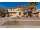 Two-story house with a three-car garage and desert landscaping at 15272 W Redfield Rd, Surprise, AZ 85379