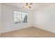 Well-lit bedroom with tile floors and window blinds at 15819 S Bentley Dr, Arizona City, AZ 85123