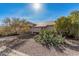 House exterior showing front entrance, landscaping, and driveway at 15819 S Bentley Dr, Arizona City, AZ 85123