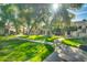 Landscaped grounds with walking paths and mature trees at 1717 E Union Hills Dr # 1033, Phoenix, AZ 85024