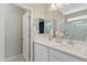 Clean bathroom with a double vanity and walk-in shower at 17352 W Country Club Ter, Surprise, AZ 85387