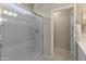Modern bathroom with a glass shower door and a white vanity at 17352 W Country Club Ter, Surprise, AZ 85387