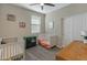 bedroom with crib, twin bed, and plenty of natural light at 17352 W Country Club Ter, Surprise, AZ 85387