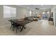 Open concept dining room with dark wood table and chairs at 17352 W Country Club Ter, Surprise, AZ 85387