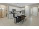 Open concept kitchen with island and stainless steel appliances at 17352 W Country Club Ter, Surprise, AZ 85387