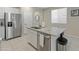 Kitchen island with granite countertop and stainless steel appliances at 17352 W Country Club Ter, Surprise, AZ 85387