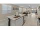 Open concept kitchen with large island and breakfast bar at 17352 W Country Club Ter, Surprise, AZ 85387