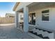 Covered patio with a Blackstone griddle and gravel flooring at 17352 W Country Club Ter, Surprise, AZ 85387