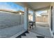 Covered patio with a Blackstone griddle and gravel flooring at 17352 W Country Club Ter, Surprise, AZ 85387