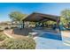 Covered playground with swings and slides at 17352 W Country Club Ter, Surprise, AZ 85387