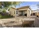 Backyard patio with seating area and artificial turf at 2014 E Hulet Pl, Chandler, AZ 85225