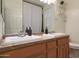 Bathroom with double vanity, wood cabinets and large mirror at 2135 N Heritage St, Buckeye, AZ 85396