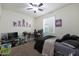 Bedroom with double bed, desk and gaming chair at 2135 N Heritage St, Buckeye, AZ 85396